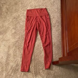 Red athletic leggings with side pockets